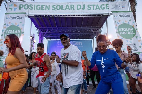 dancing at the PosiGen solar stage